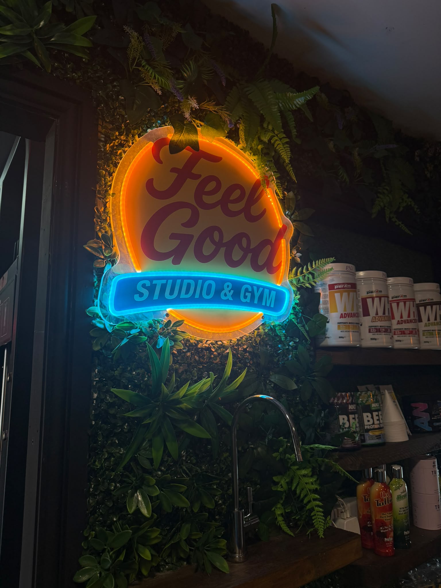 The Feel Good neon sign above the shake bar